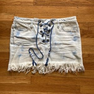Low rise acid wash denim Free People skirt with lace up front. Worn once.